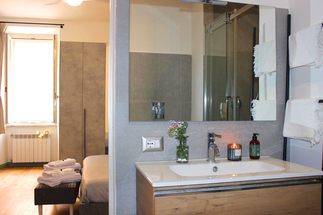 En-suite bathroom vanity with a view back into the bedroom