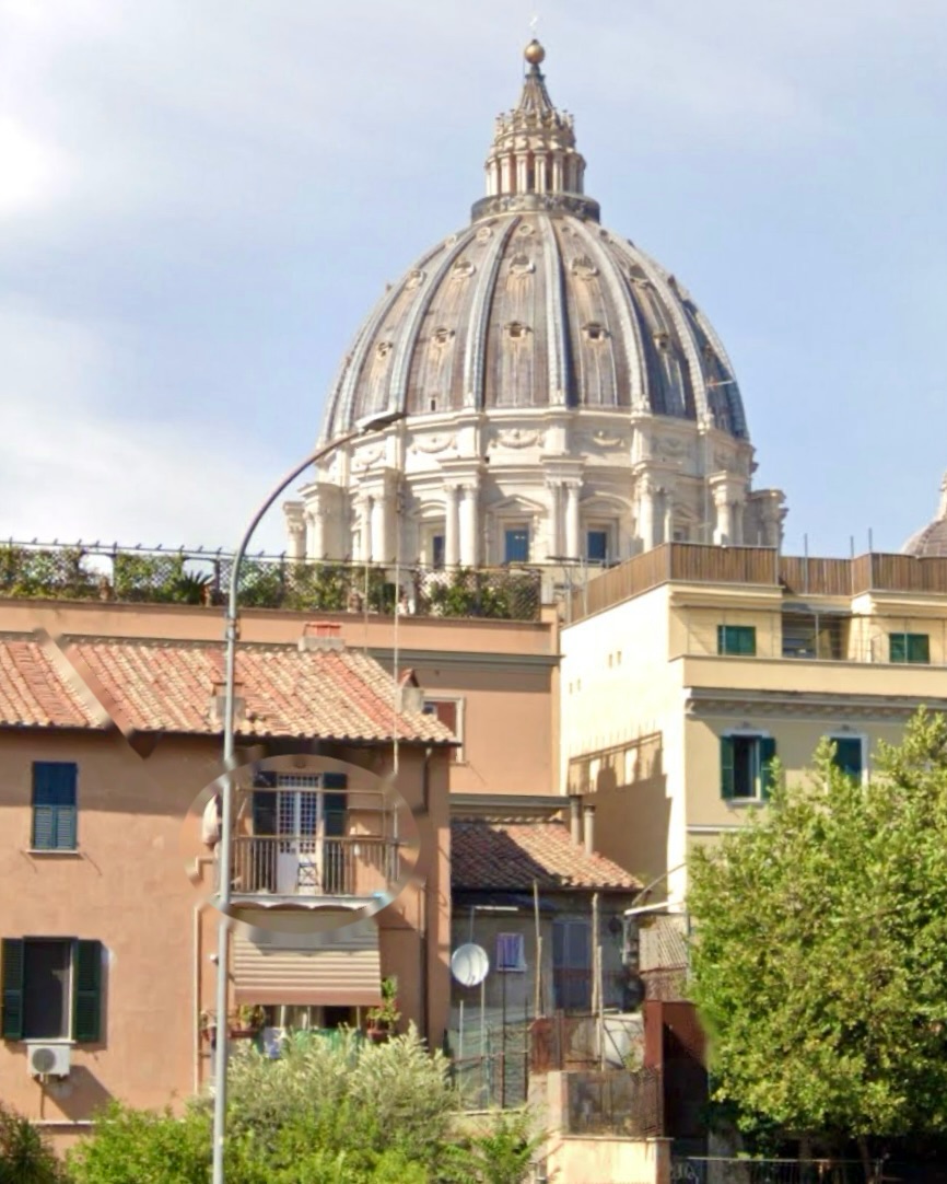 The Hideaway65 building with its balcony marked, and the dome of St. Peter's Basilica rising behind